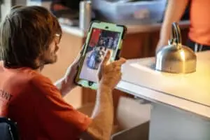 CRS emlpoyee holding a tablet