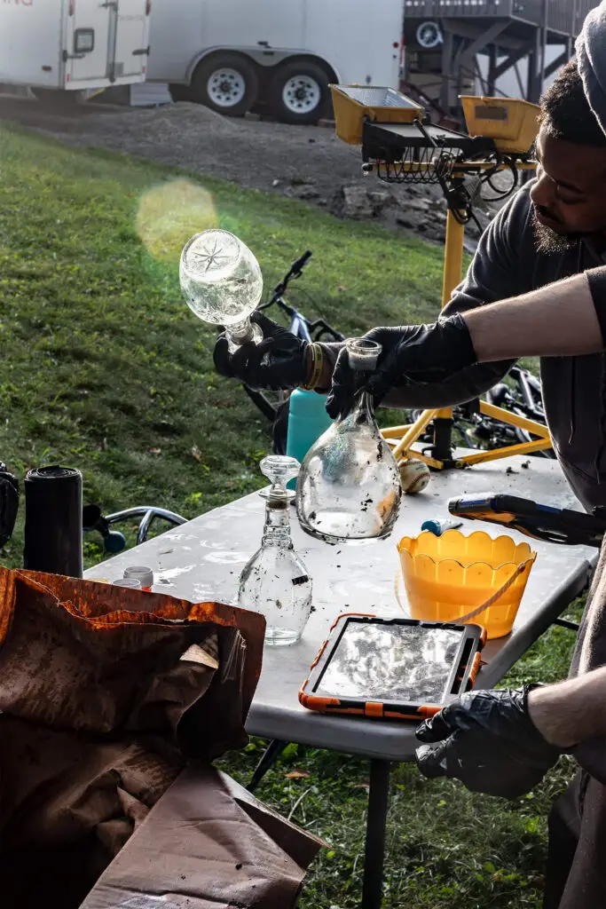 CRS employee holding a glass bottle