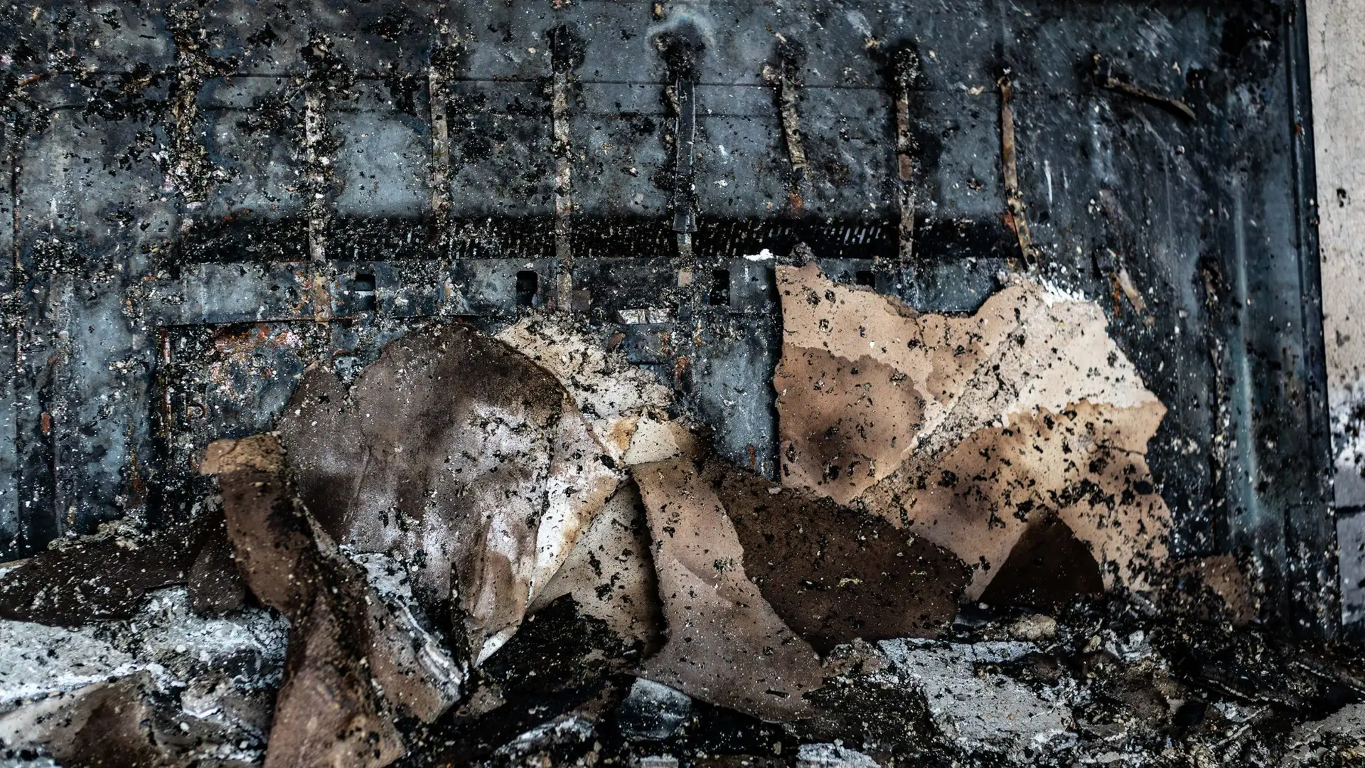 A close up burnt contents on a metal surface