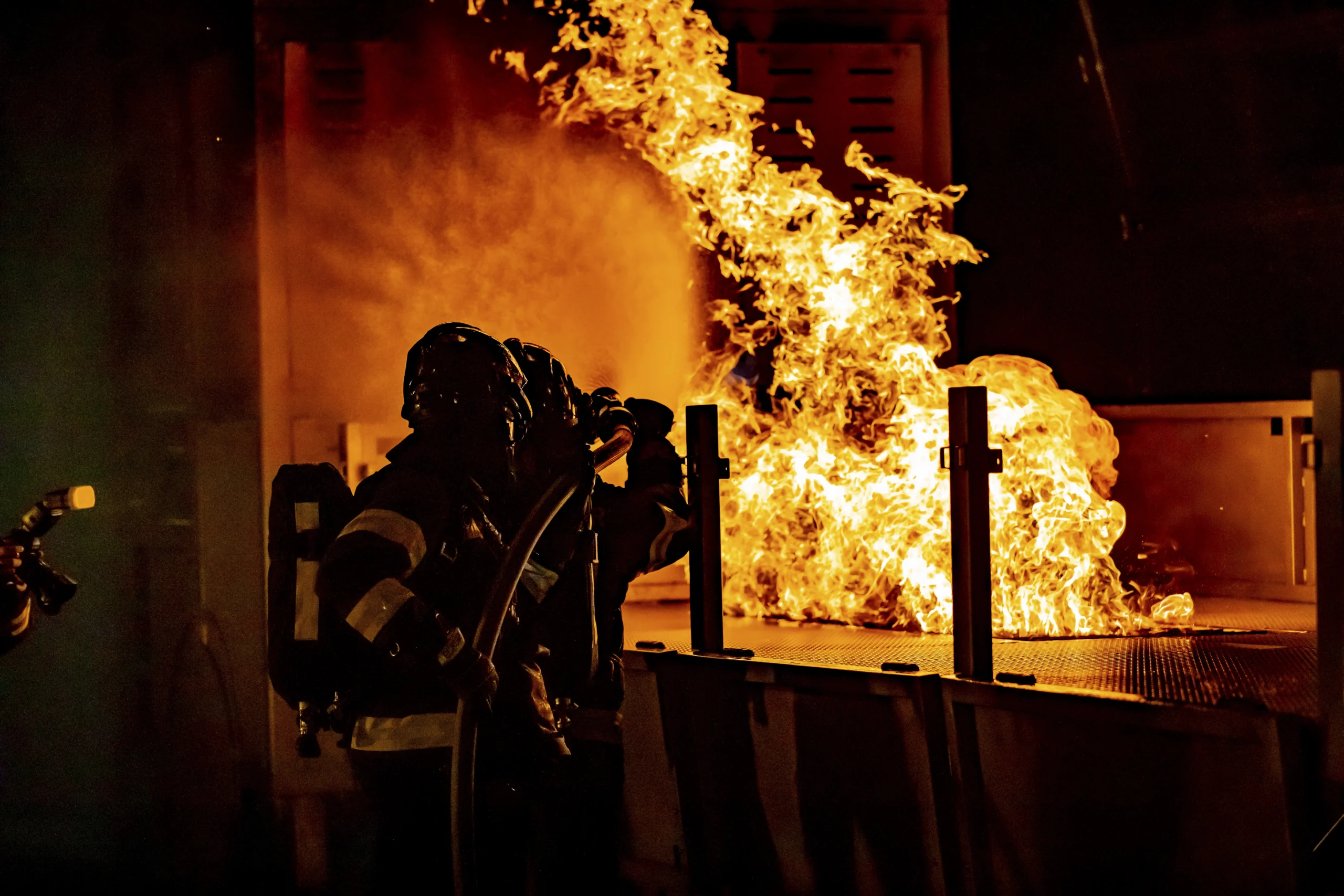 Firefighters putting out a fire in a house