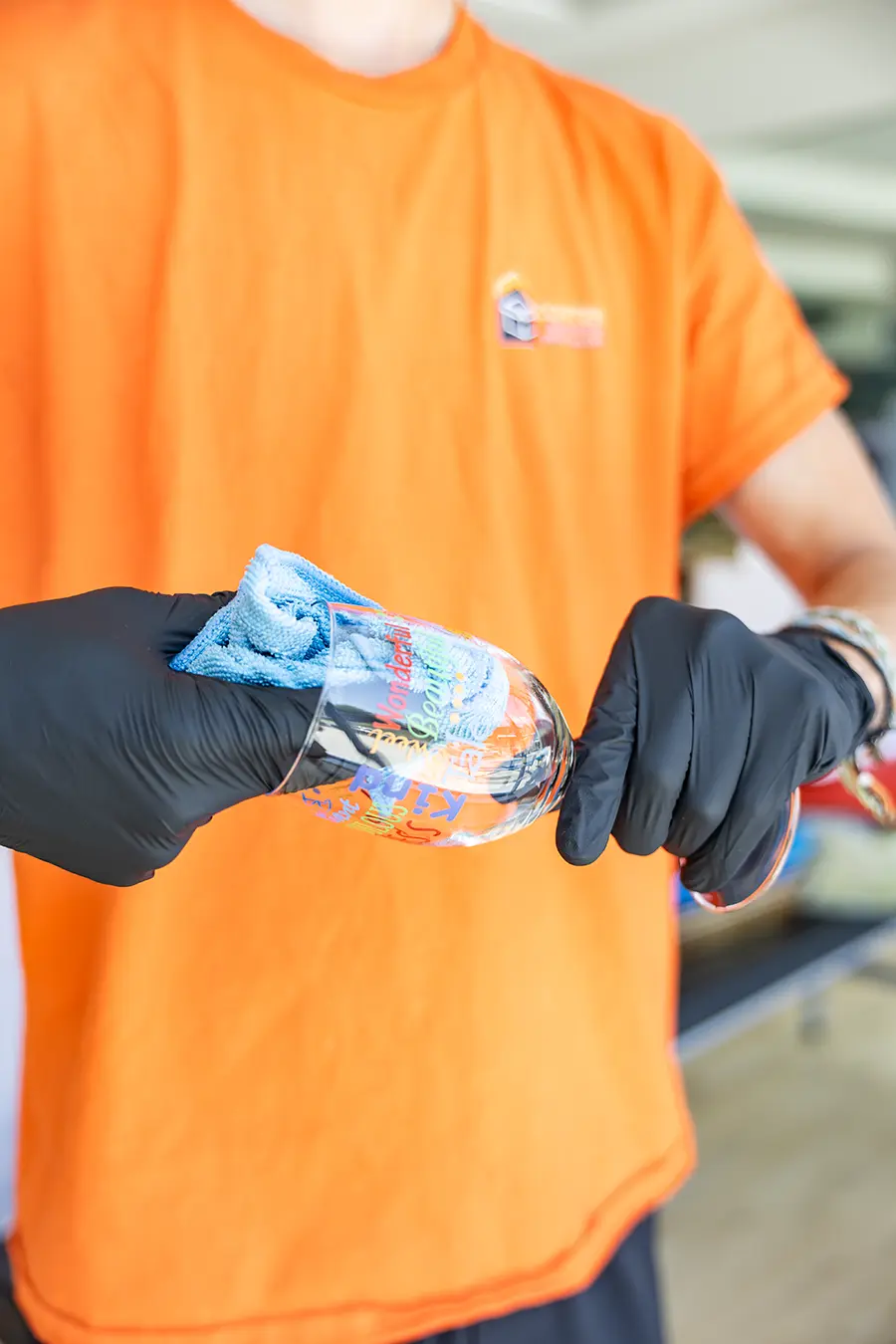 Content Recovery Specalists hand cleaning a glass